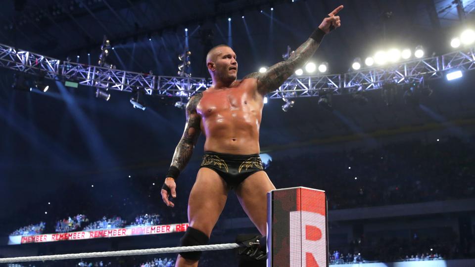 Randy Orton pointing at Wrestlemania sign